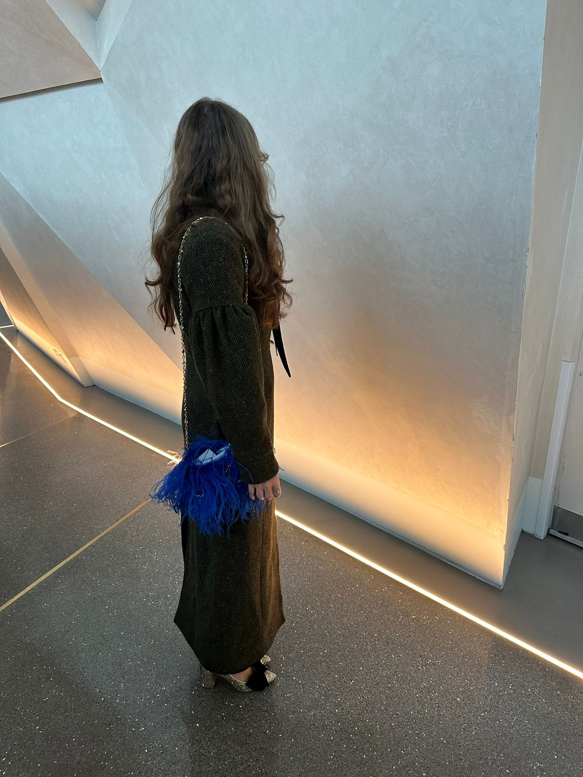 Model wearing Aoife Mc Namara Burren Long Coat Side View 